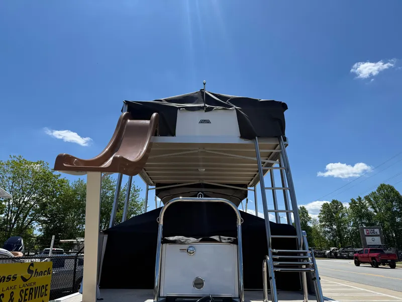 Slide: The Image of 2025 Avalon Catalina Entertainer Funship with slide under clear blue sky. - 8