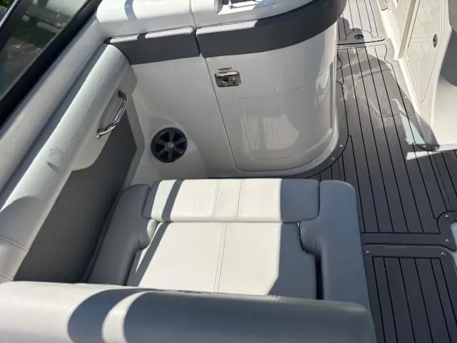 Slide: The Image of 2021 Sea Ray SDX 270 Outboard interior with white seating and sleek design. - 13