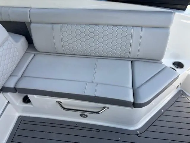 Slide: The Image of 2021 Sea Ray SDX 270 Outboard boat seating with gray upholstery and hexagonal pattern. - 14