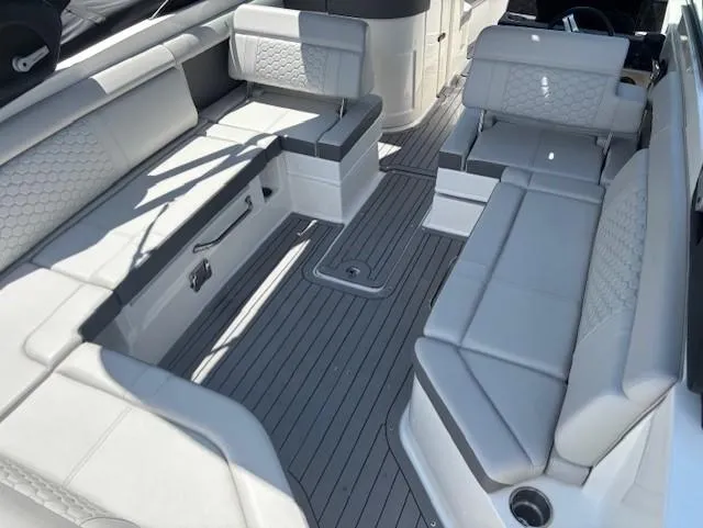 Slide: The Image of 2021 Sea Ray SDX 270 Outboard interior with spacious seating and sleek design. - 16