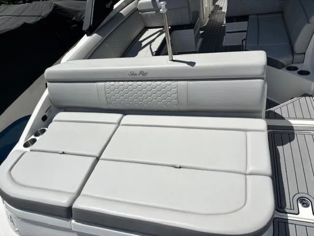 Slide: The Image of 2021 Sea Ray SDX 270 Outboard boat interior with cushioned seating and sleek design. - 17
