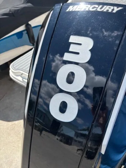 Slide: The Image of Mercury 300 outboard engine on 2021 Sea Ray SDX 270 boat, reflecting sky and clouds. - 18