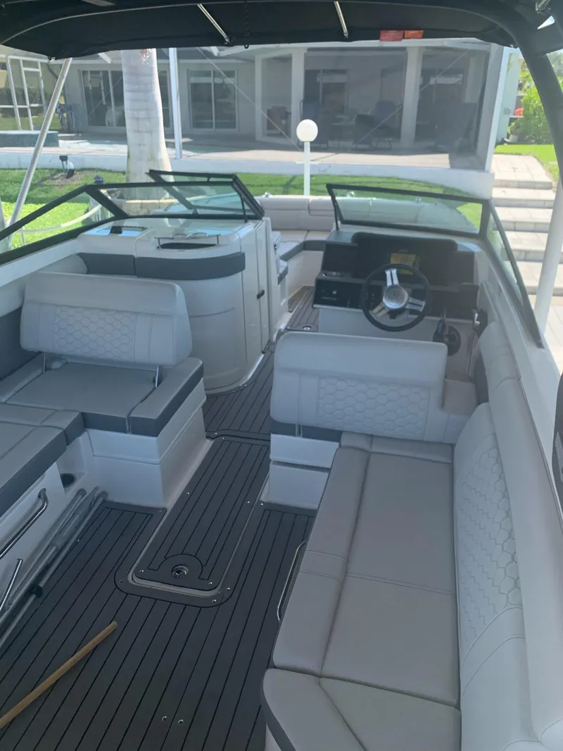 Slide: The Image of 2021 Sea Ray SDX 270 Outboard boat interior with spacious seating and modern design. - 2