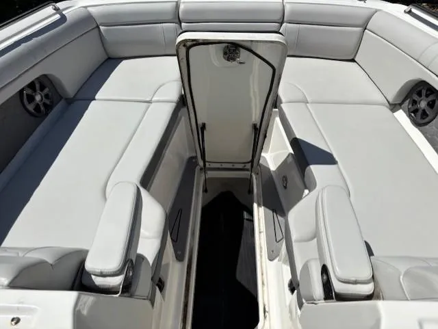 Slide: The Image of 2021 Sea Ray SDX 270 Outboard boat interior with gray seating and storage compartment. - 9