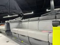 Slide: The Image of 2024 Sea-Doo Switch Cruise 21 interior with gray seating under a canopy. - 13