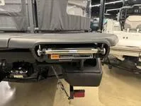 Slide: The Image of 2024 Sea-Doo Switch Cruise 21 rear view showcasing trailer hitch and storage compartment. - 17