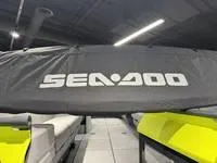 Slide: The Image of 2024 Sea-Doo Switch Cruise 21, covered, in showroom with bright lighting. - 20