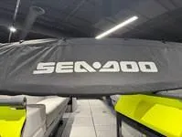 Slide: The Image of 2024 Sea-Doo Switch Cruise 21 covered, showcasing sleek design in showroom lighting. - 21