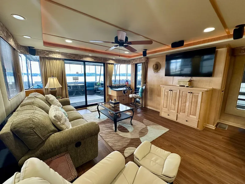 Slide: The Image of Luxurious 2006 Stardust Cruisers 16x78 houseboat interior with cozy seating and modern amenities. - 3