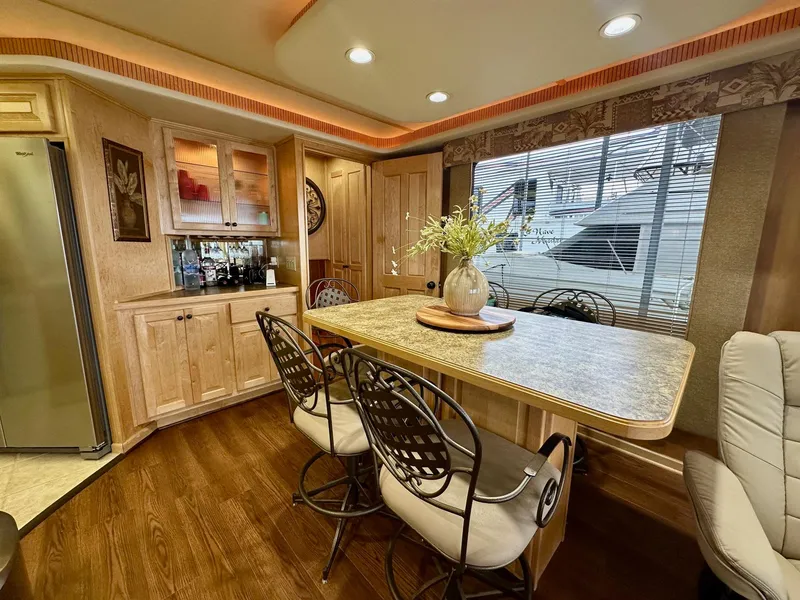 Slide: The Image of Luxurious 2006 Stardust Cruisers 16x78 houseboat interior with elegant dining area and modern decor. - 5