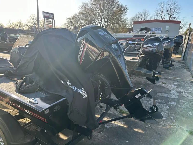 Slide: The Image of 2021 Tracker Bass Tracker Classic XL with Mercury outboard motor in a dealership lot. - 5