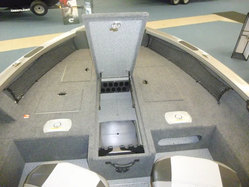Slide: The Image of 2025 Crestliner 1750 Pro Tiller boat interior with storage compartments and seating. - 4