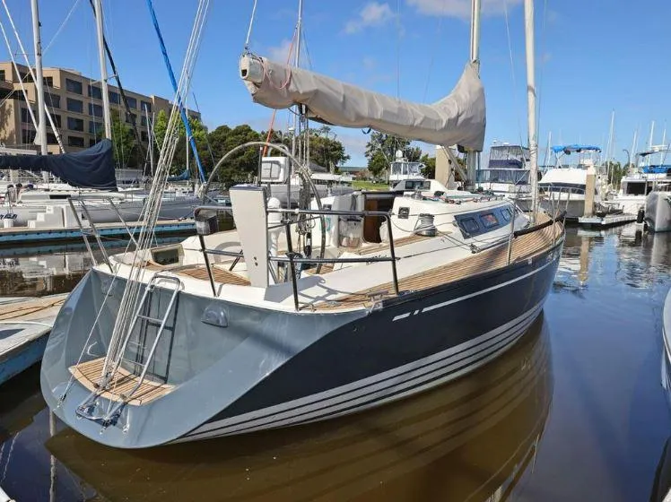 Slide: The Image of 2000 X-Yachts X-362 Sport sailboat docked in marina, featuring sleek design and spacious deck. - 0