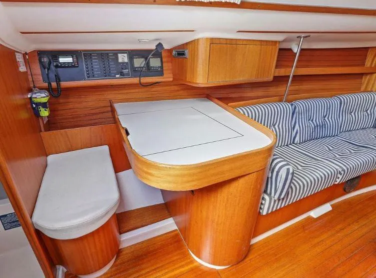 Slide: The Image of Interior of 2000 X-Yachts X-362 Sport with wooden finish and striped seating. - 15