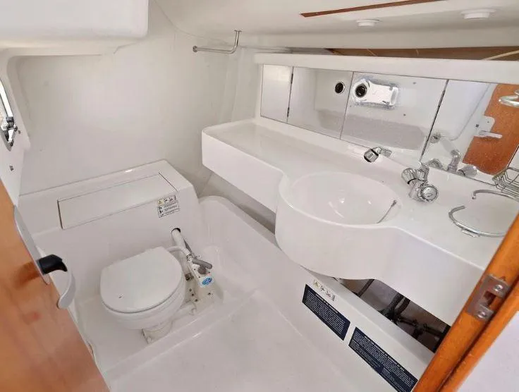 Slide: The Image of 2000 X-Yachts X-362 Sport yacht bathroom with toilet, sink, and mirror. - 20