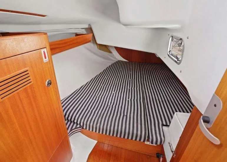 Slide: The Image of Cozy cabin interior of 2000 X-Yachts X-362 Sport with striped bedding. - 21