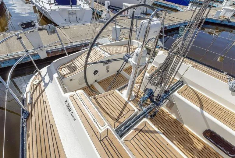 Slide: The Image of 2000 X-Yachts X-362 Sport sailboat with wooden deck and steering wheel at marina. - 6