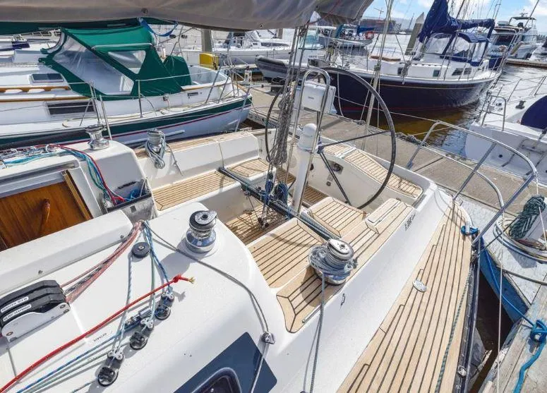 Slide: The Image of X-Yachts X-362 Sport 2000 sailboat with teak deck, docked at marina. - 7