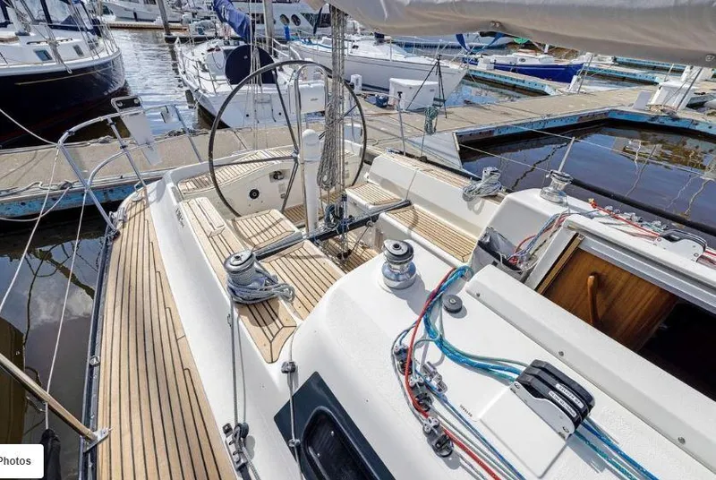 Slide: The Image of Sailing yacht X-Yachts X-362 Sport 2000 model, docked at marina, showcasing deck and cockpit. - 9