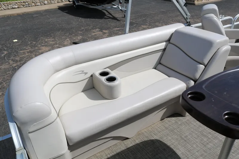 Slide: The Image of Luxurious seating on a 2015 Bennington 24SSRX pontoon boat with cup holders. - 19