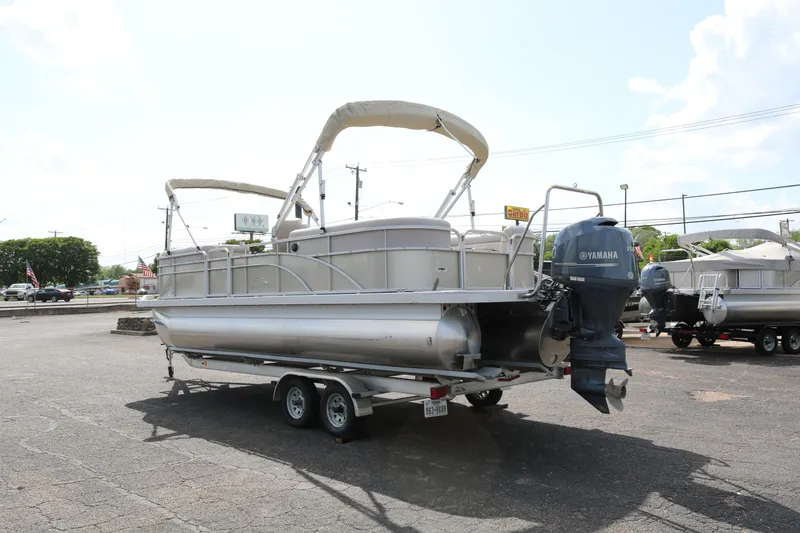 Slide: The Image of 2015 Bennington 24SSRX pontoon boat on trailer with Yamaha outboard motor. - 5