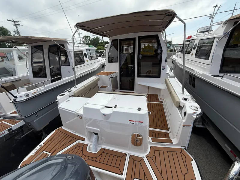 Slide: The Image of 2025 Ranger Tugs R-27 boat with spacious deck and modern design. - 4