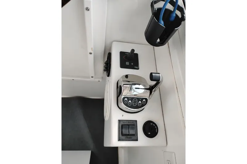 Slide: The Image of Control panel of a 2009 Albin 32 Tournament Express boat with joystick and throttle. - 21