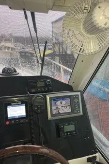 Slide: The Image of Interior view of 2009 Albin 32 TE boat cockpit with navigation equipment. - 27