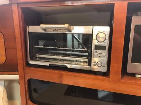 Slide: The Image of Toaster oven in wooden cabinet on Albin 32 TE, 2009 model. - 45