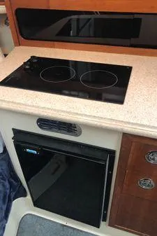 Slide: The Image of 2009 Albin 32 TE yacht kitchen with stovetop and refrigerator. - 46