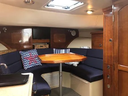 Slide: The Image of Interior of 2009 Albin 32 TE boat with cozy seating and wooden table. - 47