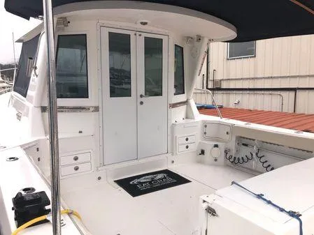 Slide: The Image of 2009 Albin 32 TE boat with spacious deck and cabin, docked at marina. - 5