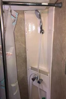 Slide: The Image of Shower area in 2009 Albin 32 TE boat with curtain and handheld showerhead. - 52
