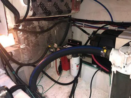 Slide: The Image of Engine compartment of a 2009 Albin 32 TE boat, showing hoses and wiring. - 59