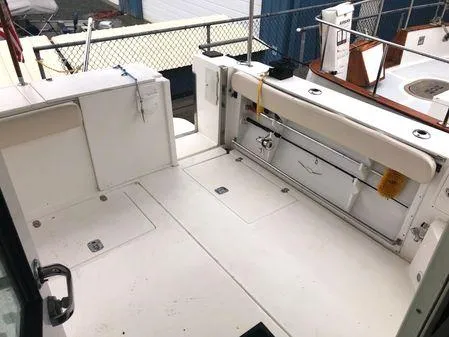 Slide: The Image of 2009 Albin 32 TE boat deck with storage compartments and seating area. - 6