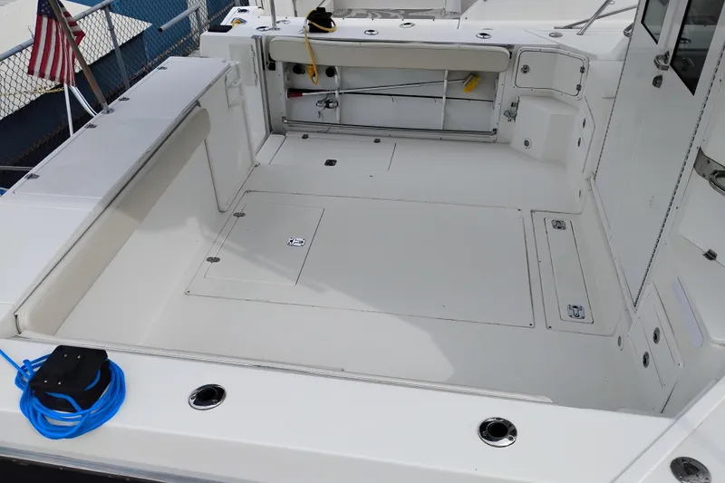 Slide: The Image of 2009 Albin 32 Tournament Express boat deck with storage compartments and seating. - 8