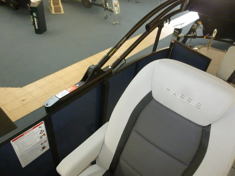Slide: The Image of 2025 Harris CX 230 boat interior with gray and white seating. - 4