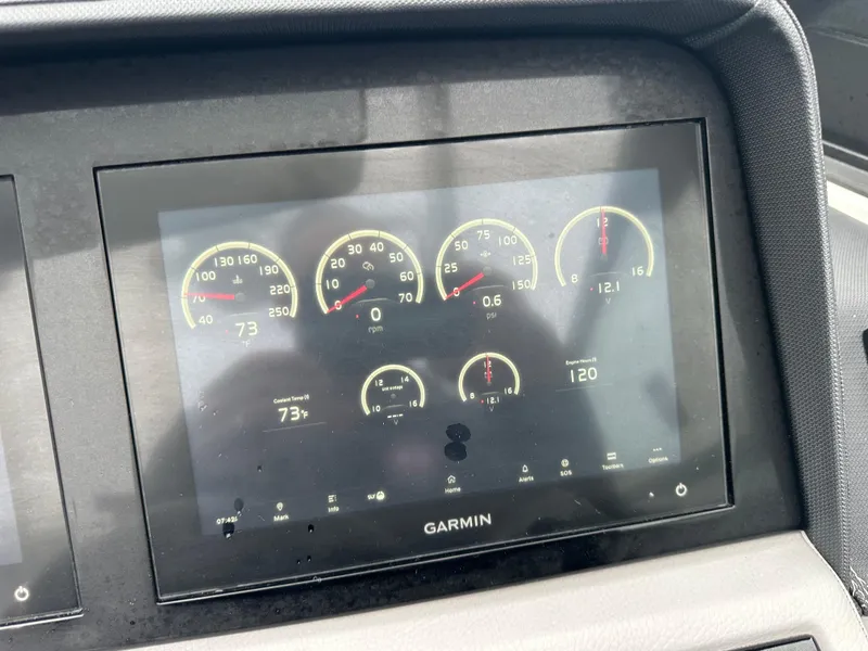 Slide: The Image of Garmin display on 2022 Cobalt R8 Surf showing various gauges and metrics. - 12