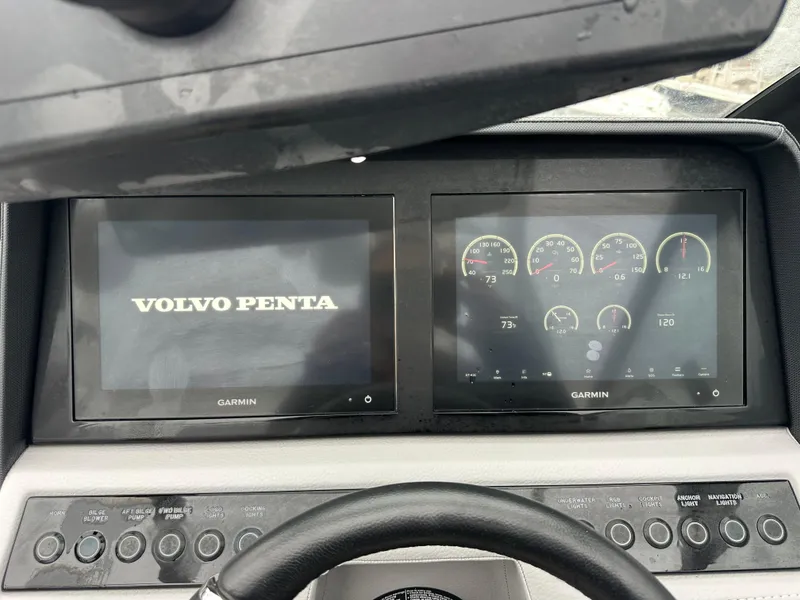 Slide: The Image of Dashboard of 2022 Cobalt R8 Surf boat with Garmin displays and Volvo Penta interface. - 13
