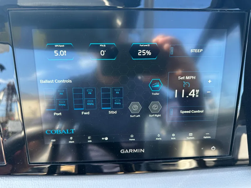 Slide: The Image of Garmin display on 2022 Cobalt R8 Surf boat showing speed and ballast controls. - 14