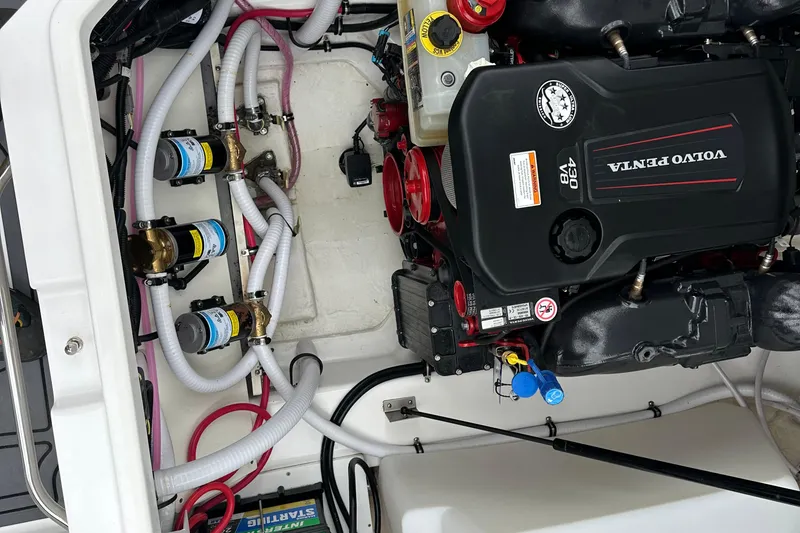 Slide: The Image of Engine compartment of a 2022 Cobalt R8 Surf boat with Volvo Penta engine. - 24