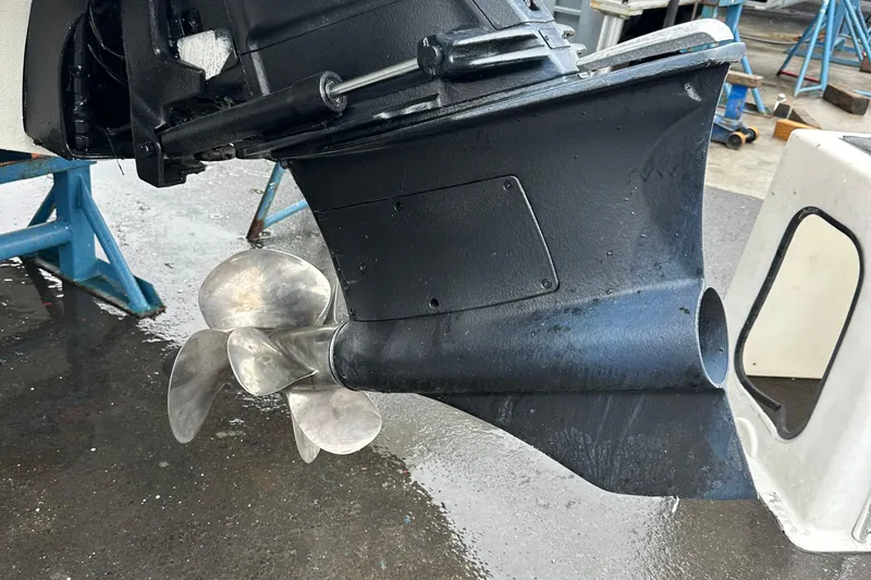 Slide: The Image of Propeller of 2022 Cobalt R8 Surf boat on a wet surface. - 31