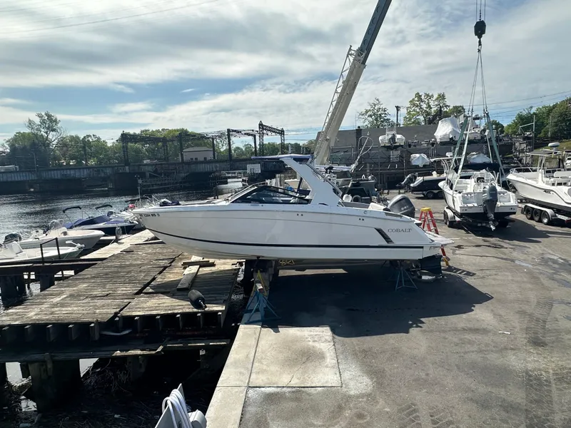 Slide: The Image of 2022 Cobalt R8 Surf boat on dock, ready for launch. - 40