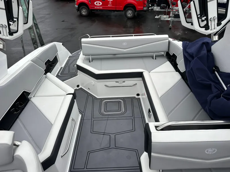 Slide: The Image of 2022 Cobalt R8 Surf boat interior with gray seating and sleek design. - 9