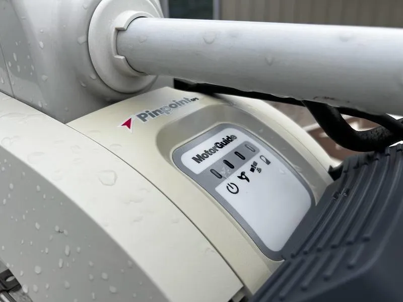 Slide: The Image of Close-up of a 2021 Xpress H20B boat's MotorGuide Pinpoint GPS system with raindrops. - 10