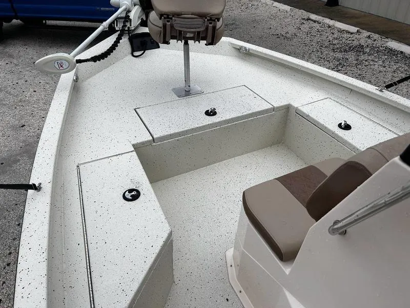 Slide: The Image of 2021 Xpress H20B boat interior with seating and storage compartments. - 11