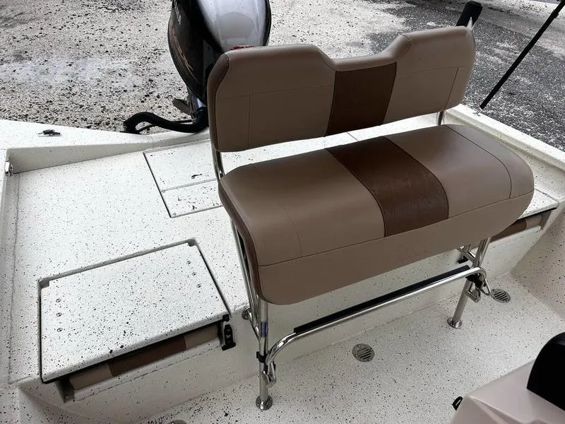 Slide: The Image of 2021 Xpress H20B boat with brown seating and white deck. - 12