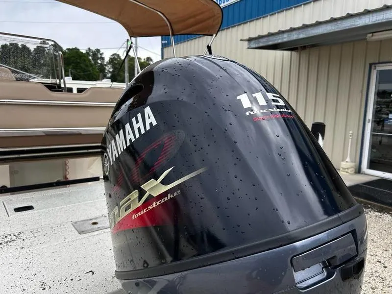 Slide: The Image of Yamaha 115 VMAX outboard motor on 2021 Xpress H20B boat, wet with raindrops. - 14
