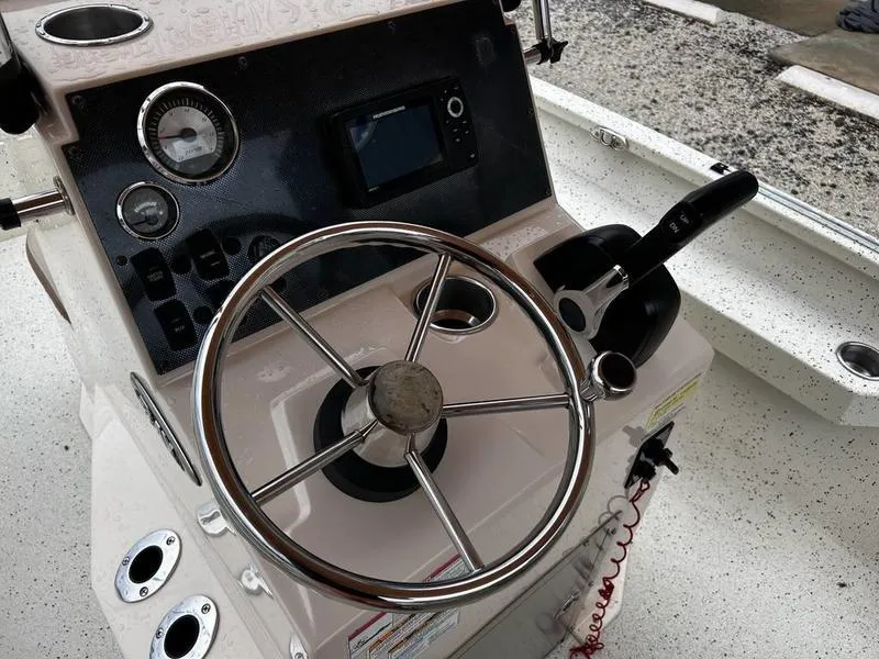 Slide: The Image of Steering console of 2021 Xpress H20B boat with controls and gauges. - 8