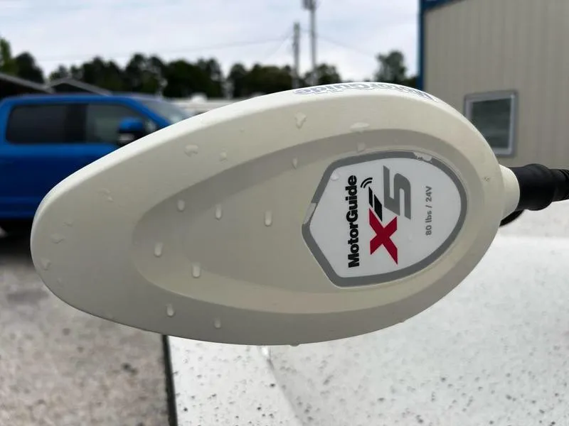 Slide: The Image of MotorGuide X5 trolling motor on 2021 Xpress H20B boat, close-up with water droplets. - 9